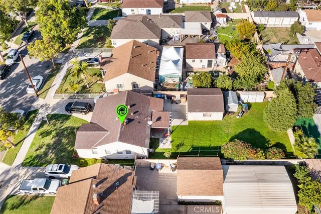an aerial view of a house with swimming pool and outdoor space