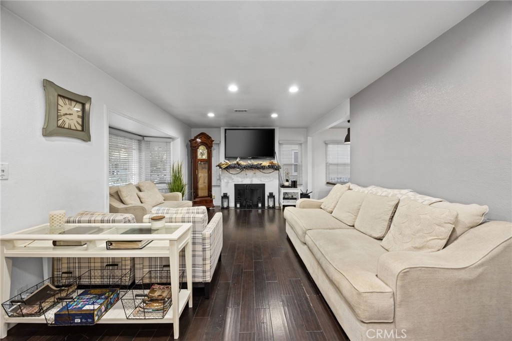 1231 South Baker Street Santa Ana, CA 92707 - Photo 5 of 48 a living room with furniture and a fireplace