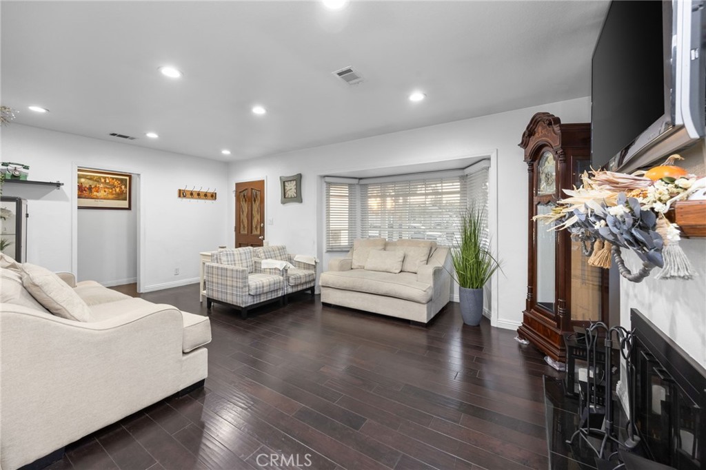 1231 South Baker Street Santa Ana, CA 92707 - Photo 6 of 48 a living room with furniture and a wooden floor