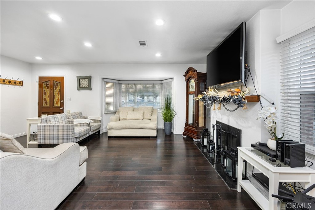 1231 South Baker Street Santa Ana, CA 92707 - Photo 7 of 48 a living room with furniture and fireplace