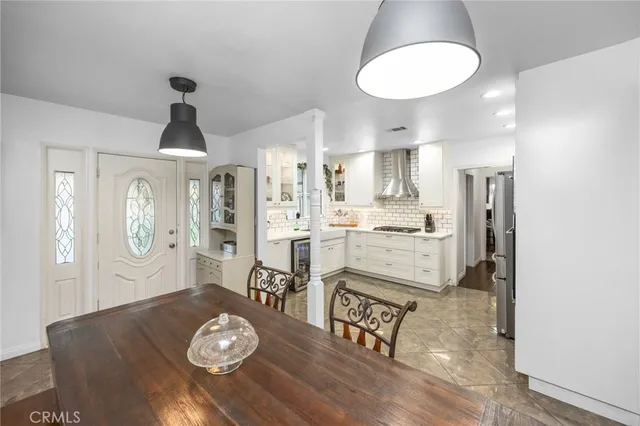 a kitchen with a table and chairs in it