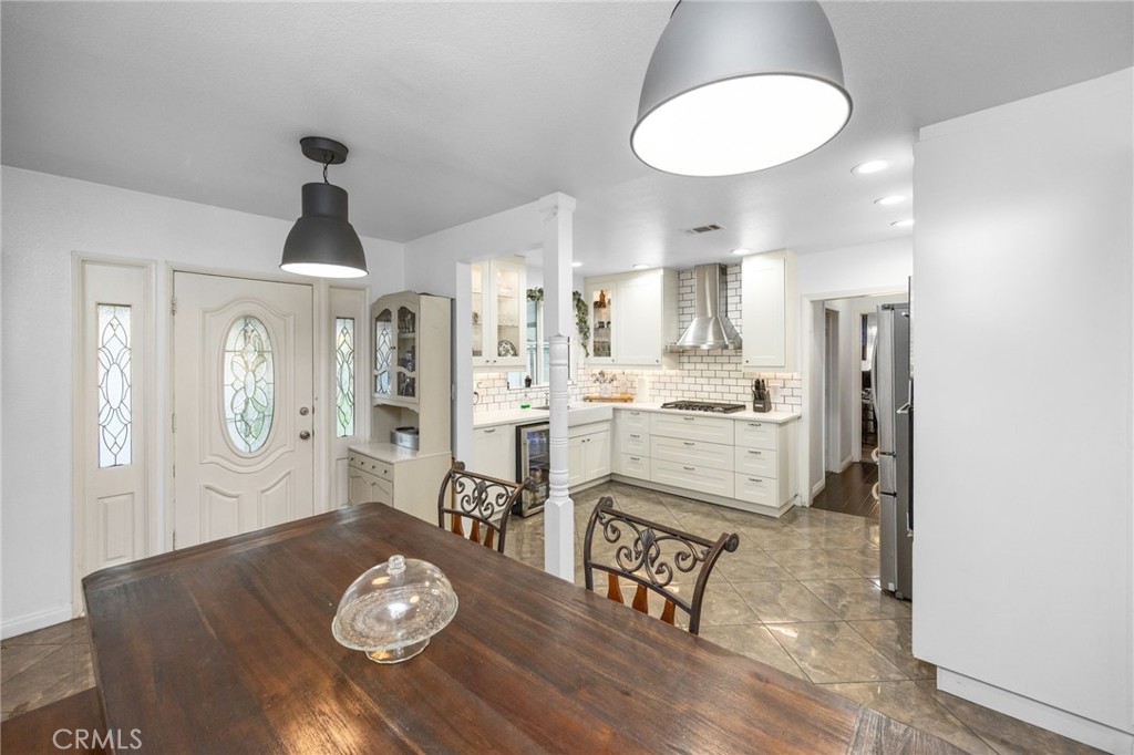 1231 South Baker Street Santa Ana, CA 92707 - Photo 10 of 48 a kitchen with a table and chairs in it