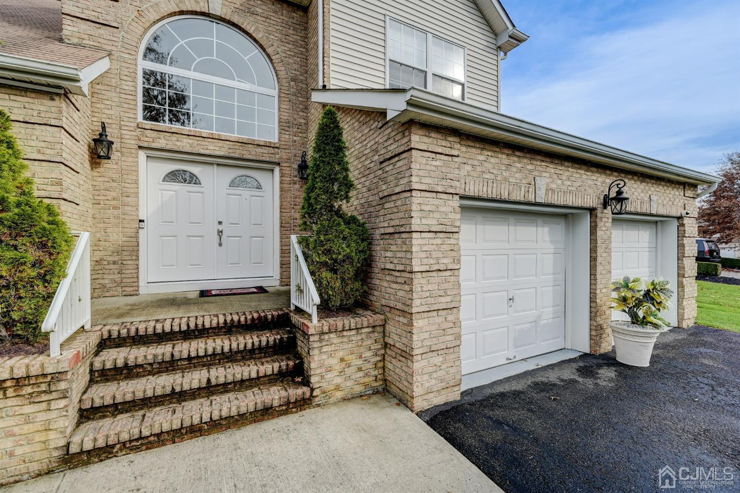 67 Gate Lane Old Bridge, NJ 08857 - Photo 2 of 39 a front view of a house with a garden