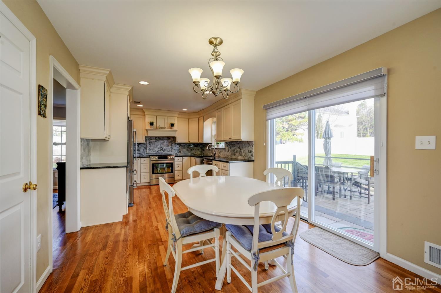 67 Gate Lane Old Bridge, NJ 08857 - Photo 12 of 39 a view of a dining room with furniture and a chandelier