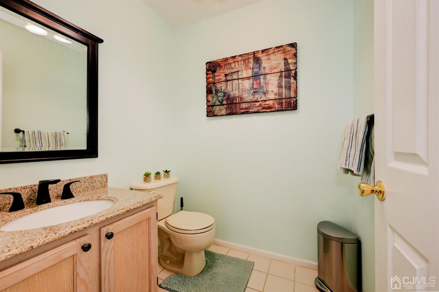 67 Gate Lane Old Bridge, NJ 08857 - Photo 16 of 39 a bathroom with a granite countertop toilet sink and mirror