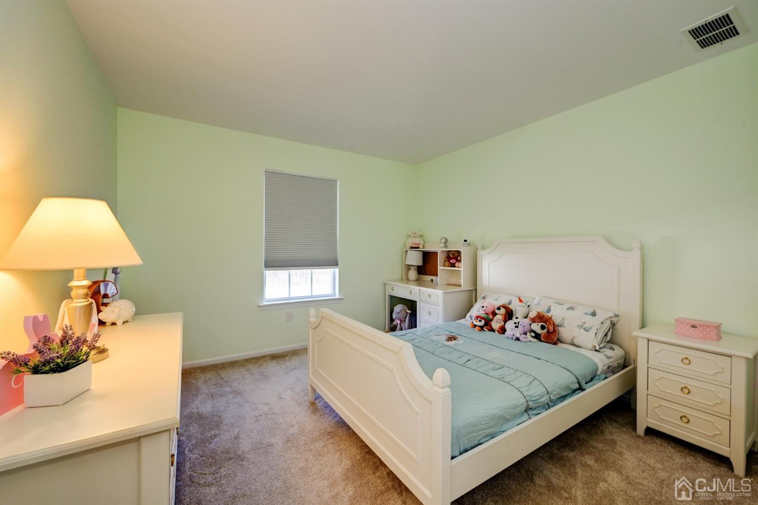 67 Gate Lane Old Bridge, NJ 08857 - Photo 20 of 39 a bedroom with a bed and a dresser in it