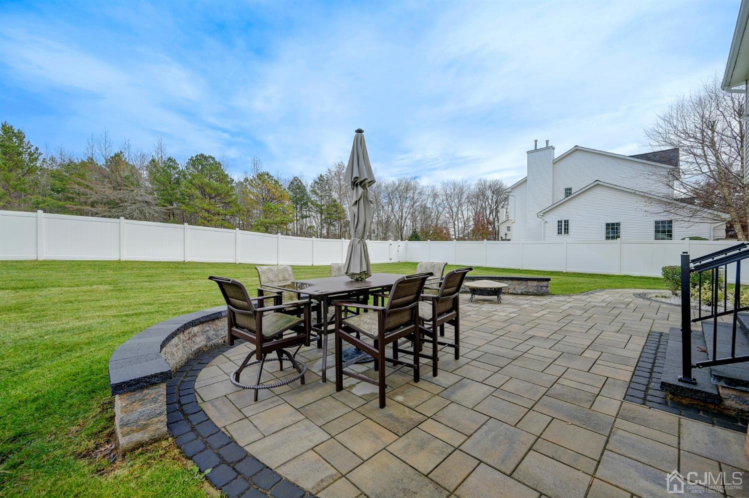 67 Gate Lane Old Bridge, NJ 08857 - Photo 33 of 39 a view of a patio with table and chairs near a yard