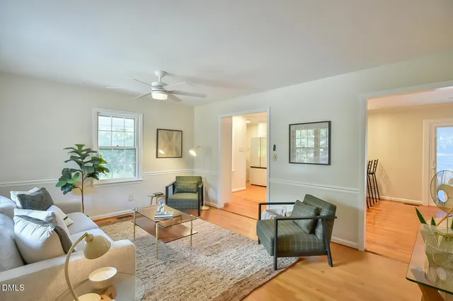 a living room with furniture and a table