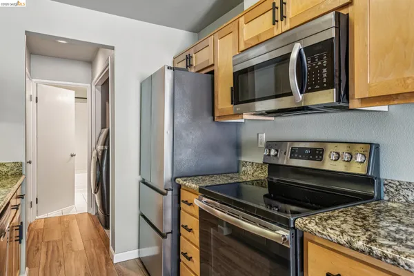 a kitchen with a stove microwave and refrigerator