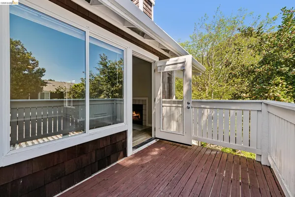 a view of balcony with wooden floor