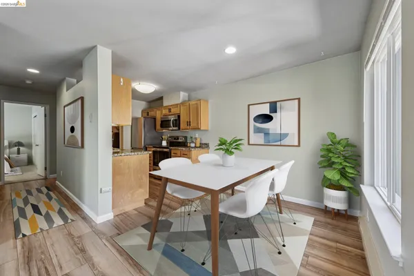 a view of kitchen with furniture and wooden floor