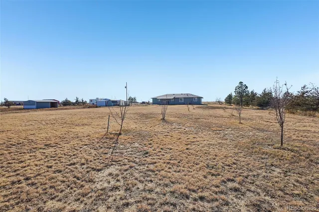 a house view with a backyard space