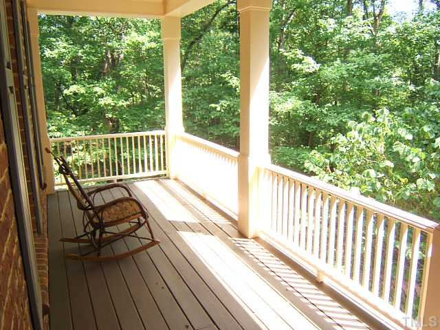 1908 Partridge Berry Drive Raleigh, NC 27606 - Photo 9 of 12 Large double front porches overlook the private front yard. Porch