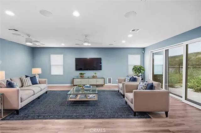 a bedroom with a bed and a flat screen television