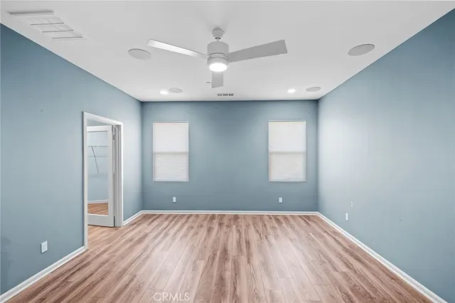 a bathroom with a double vanity sink mirror and bathtub
