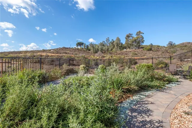 a view of a backyard with sitting area
