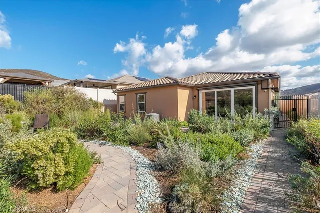 an aerial view of a house with a lake view