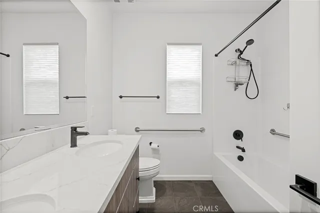 a bedroom with a bed and a flat screen television