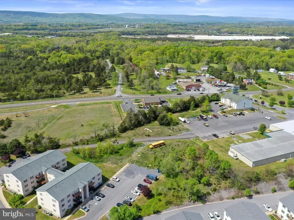 an aerial view of a houses with a yard