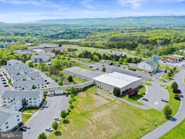 an aerial view of a house with big yard