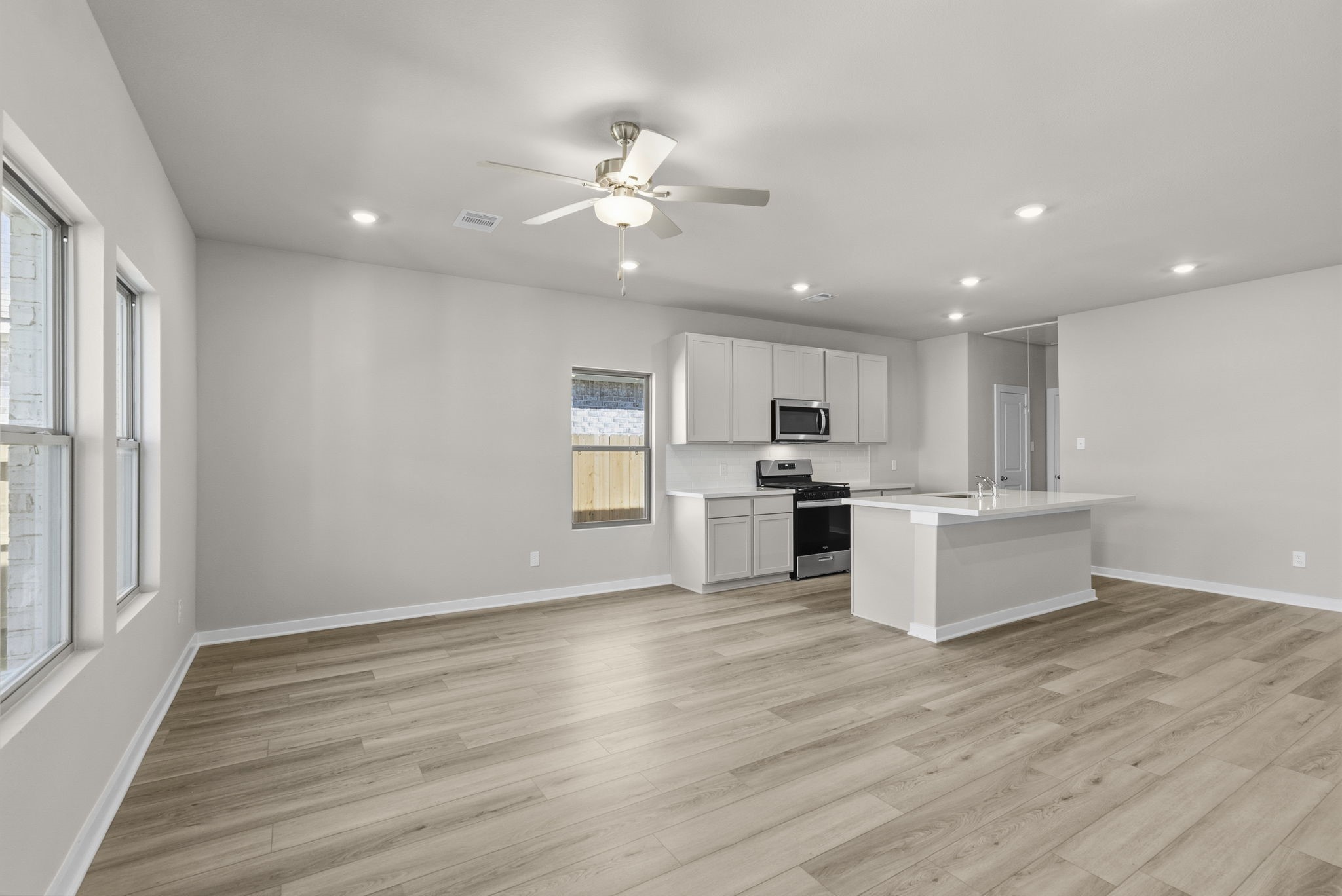 3627 Atlas Pt Lane Angleton, TX 77515 - Photo 13 of 36 a view of kitchen with wooden floor and window