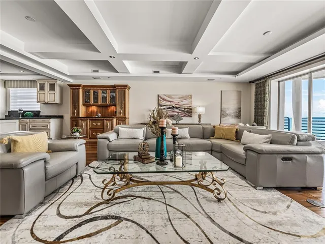 a bedroom with a large bed and a large window