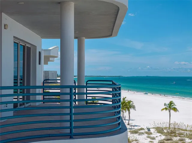 a view of a hallway with paintings on the wall