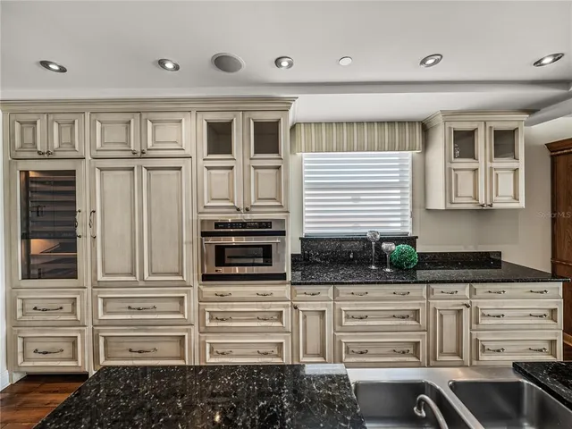 a view of a hallway with workspace and wooden floor