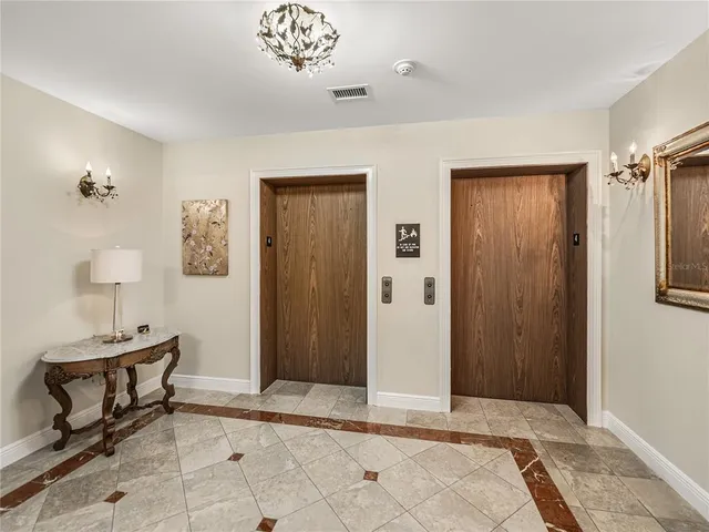 a bathroom with a toilet a sink and a mirror