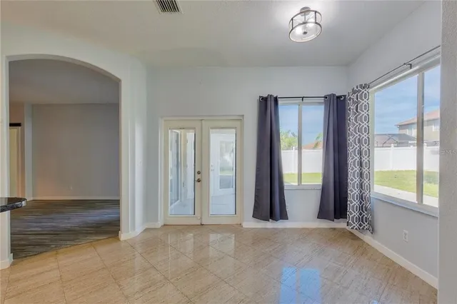 an empty room with windows