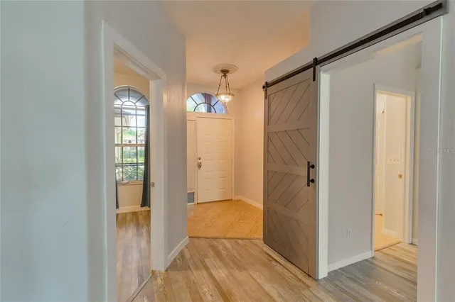 a view of entryway with wooden floor