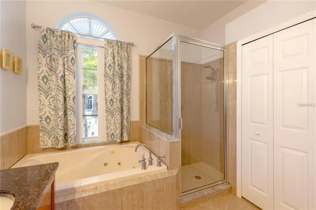 a bathroom with a bathtub and a shower