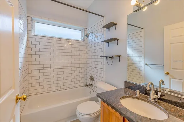 a bathroom with a sink a toilet and bathtub