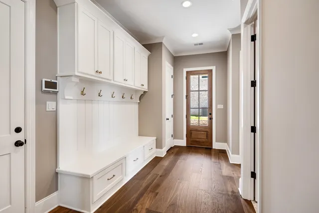 a kitchen with a sink cabinets and appliances