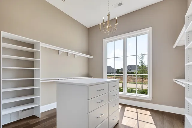 a bathroom with a shower and a sink