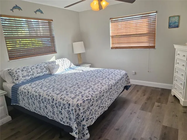 a bedroom with bed and window