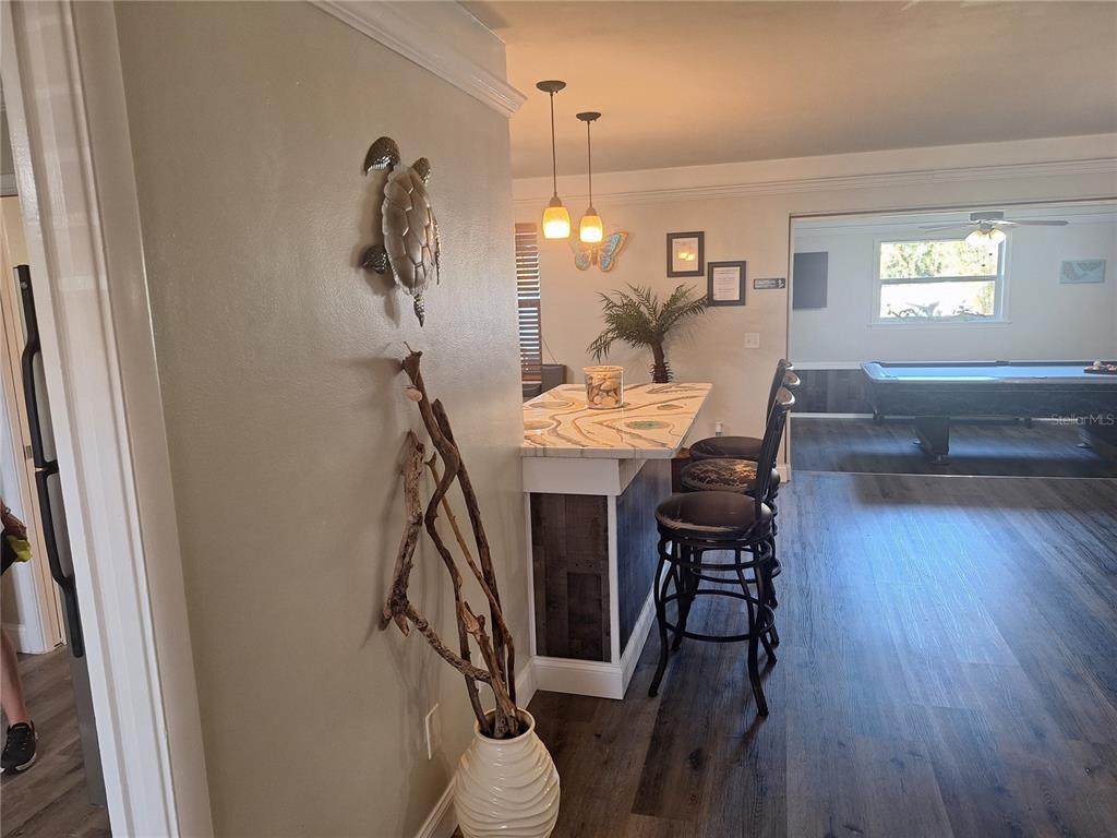 1202 South Keene Road Clearwater, FL 33756 - Photo 18 of 46 a view of a dining room with furniture window and wooden floor