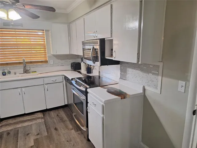 a kitchen with a table chairs and a sink