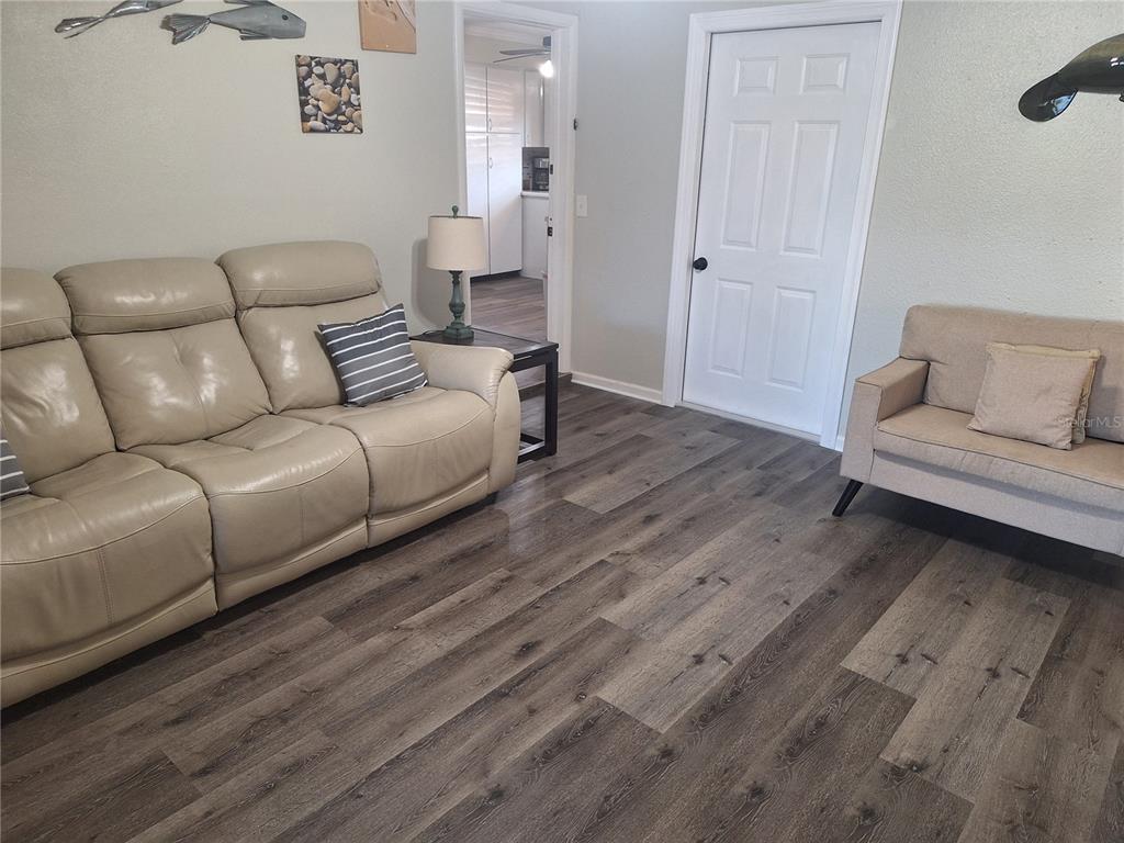 1202 South Keene Road Clearwater, FL 33756 - Photo 25 of 46 a living room with furniture and a wooden floor