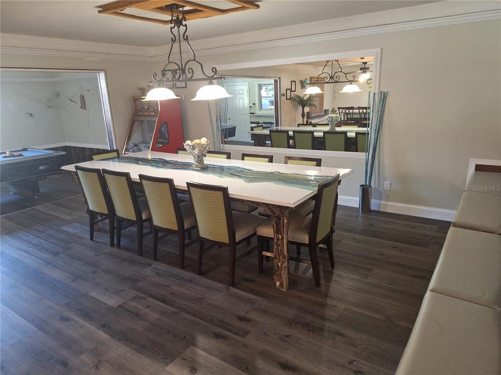 1202 South Keene Road Clearwater, FL 33756 - Photo 32 of 46 a view of a dining room with furniture window and wooden floor