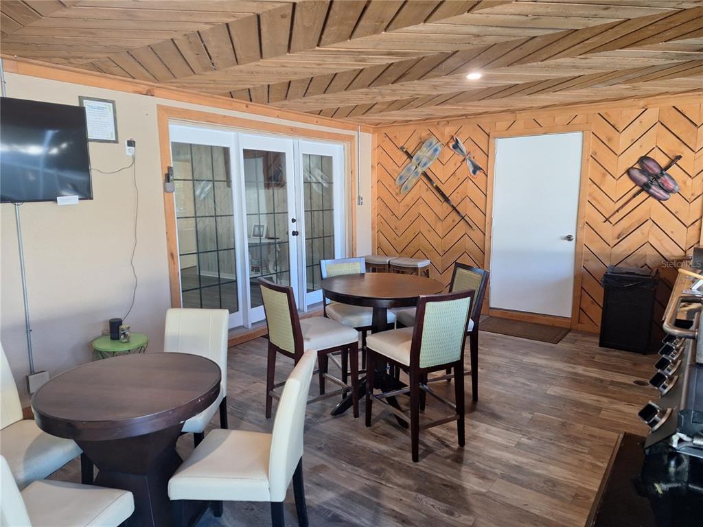 1202 South Keene Road Clearwater, FL 33756 - Photo 40 of 46 a view of a dining room with furniture and wooden floor