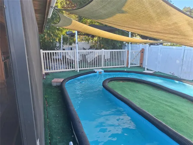 a view of swimming pool from a balcony