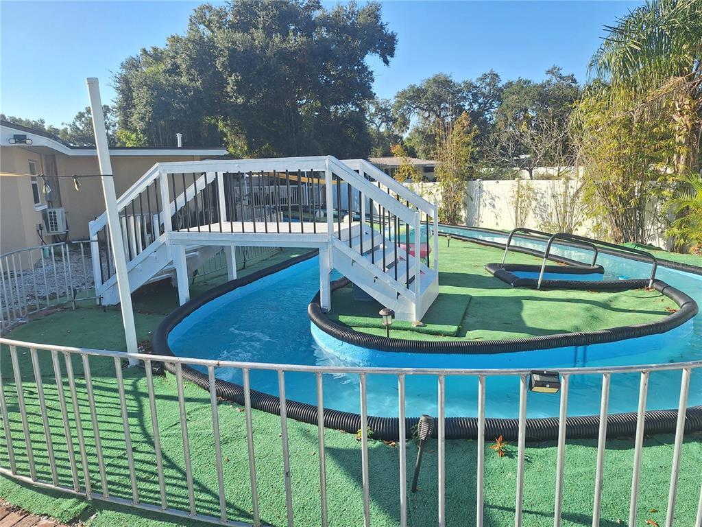 1202 South Keene Road Clearwater, FL 33756 - Photo 45 of 46 a view of a swimming pool with a deck