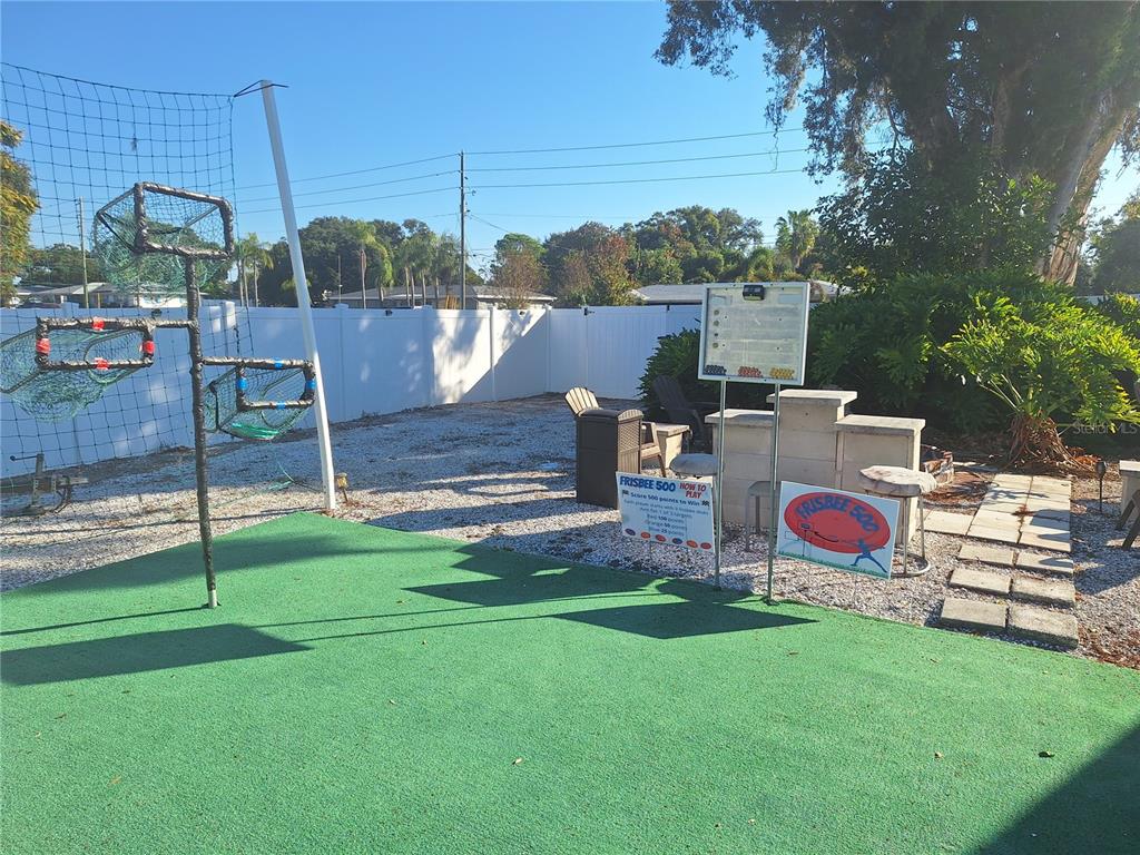 1202 South Keene Road Clearwater, FL 33756 - Photo 46 of 46 a childrens park with lots of swings slides and swimming pool