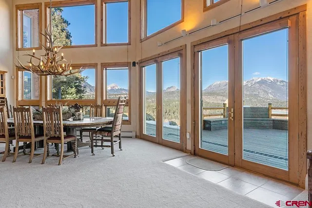 a front view of a house with outdoor seating