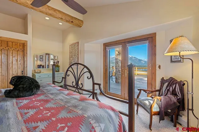 a living room with furniture ceiling fan and a window
