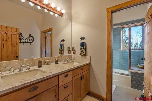 a kitchen with stainless steel appliances a sink and cabinets