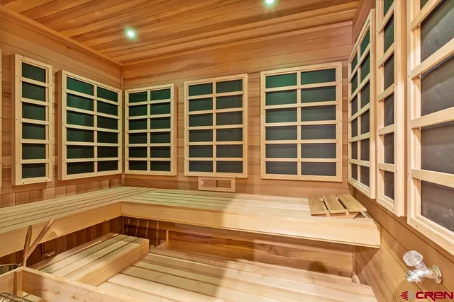 a view of a city with lots of residential buildings ocean and mountain view in back