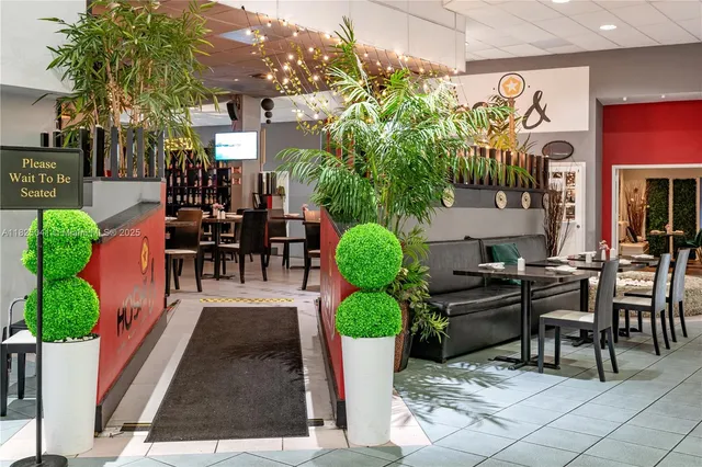 a view of a tables and chairs in a patio