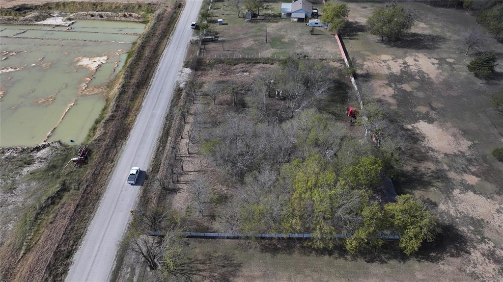 5601 Bilindsay Road Seagoville, TX 75159 - Photo 3 of 12 a view of a dry yard with wooden fence